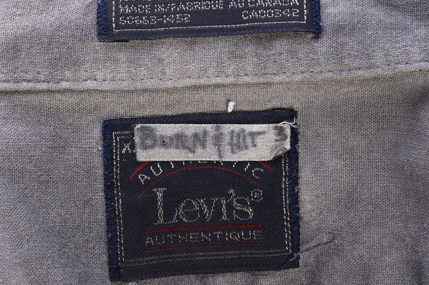 screen used shirt tag small.jpg